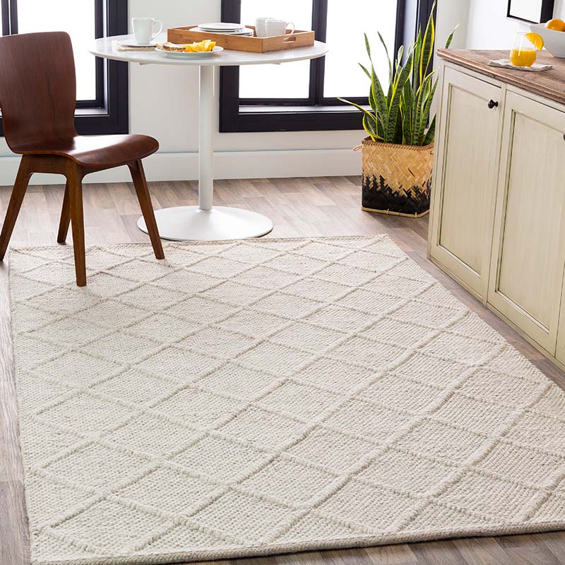 Single-tone light beige rectangular area rug with diamond relief pattern by Surya. Name: Napels. Pattern NPL2303. ©Surya