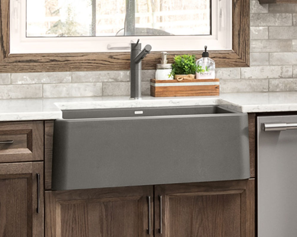 Blanco® sink and kitchen sink. Grey farmhouse sink with matte gray faucet. Photo by Illia Sternichuk.