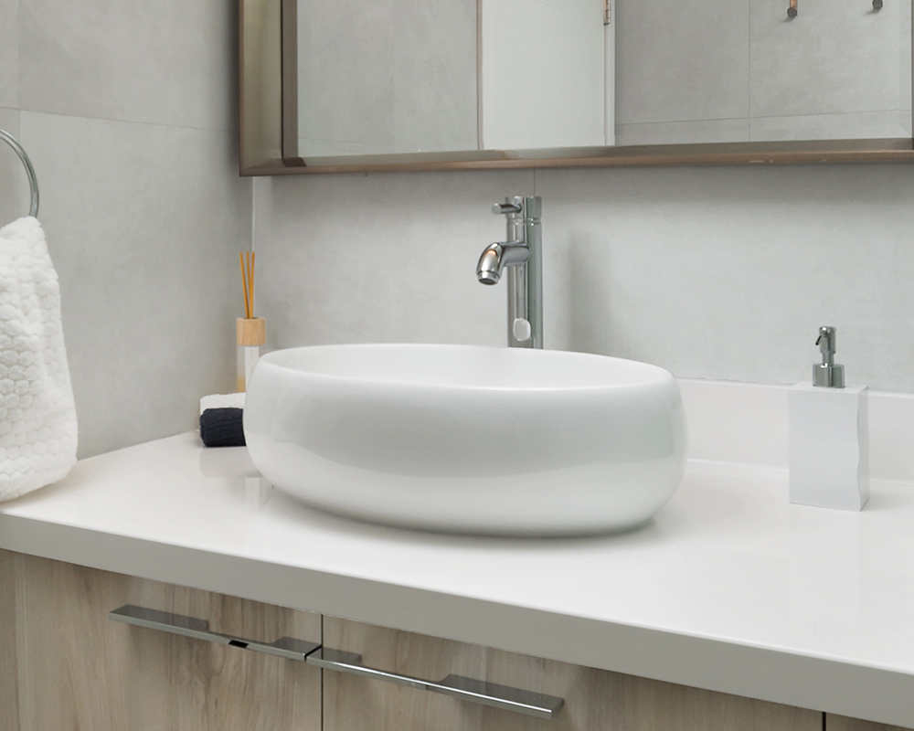 Pearl® bowl-type white vanity sink and nickel-plated faucet. Photo by Illia Sternichuk.